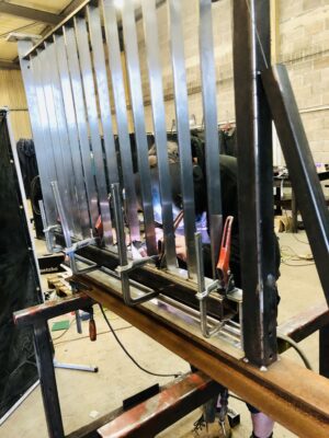 Neil Hart, Tig welding the flats for the stainless-steel balustrading.