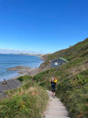 Site fitter on the way to a job on the beach in Cornwall