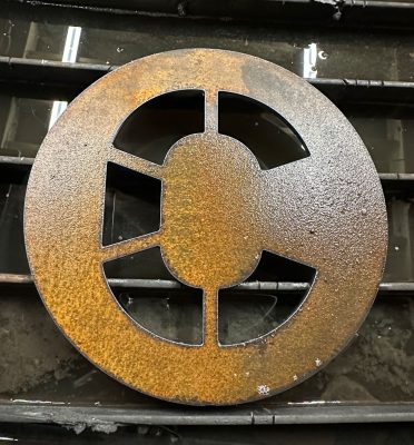 Crewing company logo cut into metal