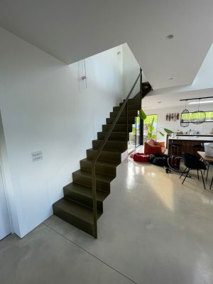 Bespoke folded metal staircase with bronze paint finish