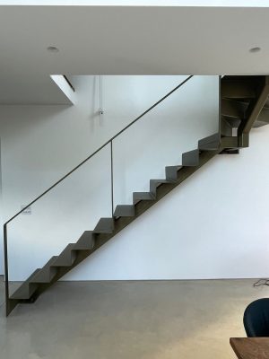 Bespoke folded metal staircase with bronze paint finish